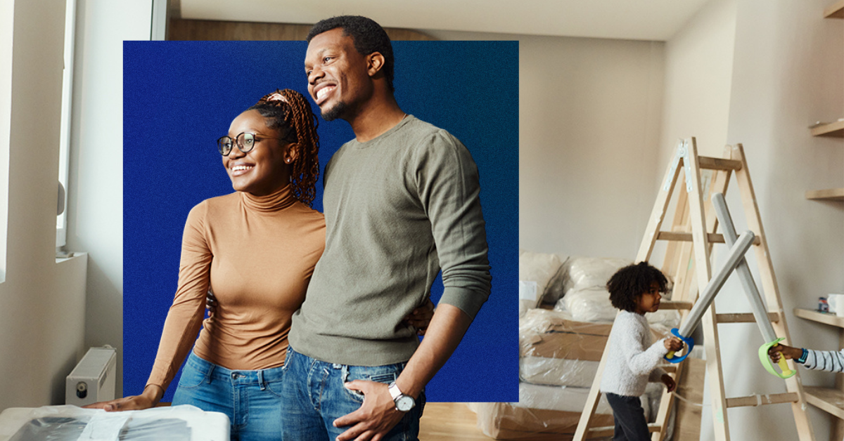 couple in house looking out a window
